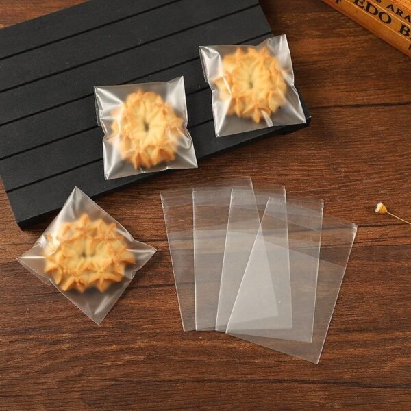 100Pcs-Transparent-Frosted-Cookie-Candy-OPP-Bag-Self-Adhesive-Plastic-Biscuits-Snack-Baking-Package.jpg Transparent Frosted Cookie Candy OPP Bag Self-Adhesive Plastic Biscuits Snack Baking Package